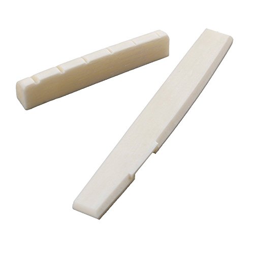 Conjunto de puente y cejuela de HUESO NATURAL para guitarra acústica. No es ABS, resinas o plástico. Conjunto de puente y cejuela de HUESO NATURAL para guitarra acústica. No es ABS, resinas o plástico.