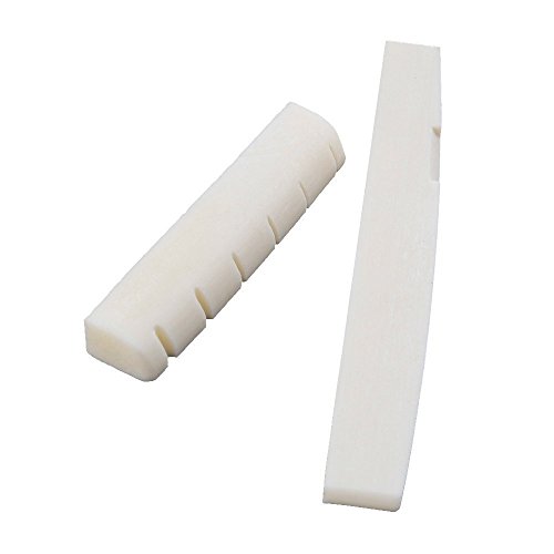 Conjunto de puente y cejuela de HUESO NATURAL para guitarra acústica. No es ABS, resinas o plástico. Conjunto de puente y cejuela de HUESO NATURAL para guitarra acústica. No es ABS, resinas o plástico.