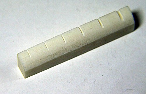 Conjunto de puente y cejuela de HUESO NATURAL para guitarra acústica. No es ABS, resinas o plástico. Conjunto de puente y cejuela de HUESO NATURAL para guitarra acústica. No es ABS, resinas o plástico.