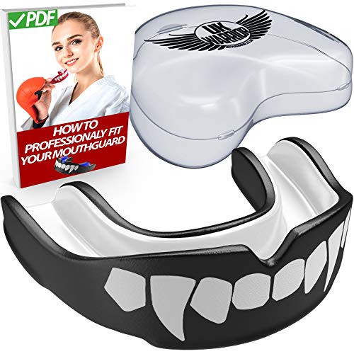 Protector bucal UK Warrior "Vampire", para boxeo, artes marciales, karate y otros deportes de contacto, incluye caso con instrucciones de (español no garantizado) - color blanco y negro , tamaño niño Protector bucal UK Warrior "Vampire", para boxeo, artes marciales, karate y otros deportes de contacto, incluye caso con instrucciones de (español no garantizado) - color blanco y negro , tamaño niño