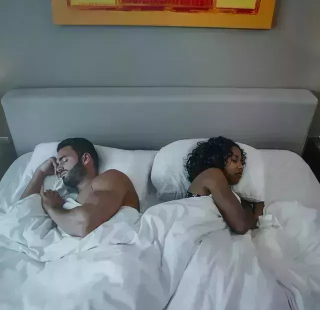 couple sleeping in bed