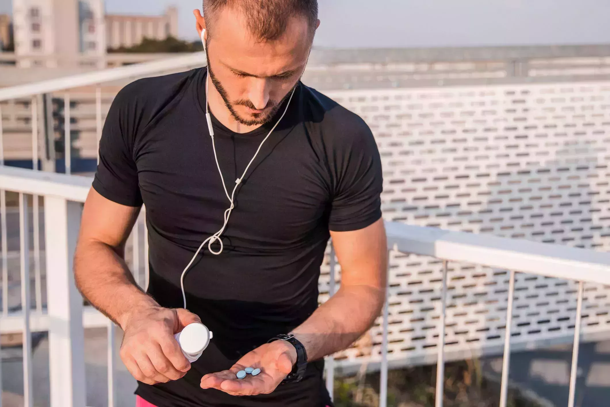 fit man taking vitamins