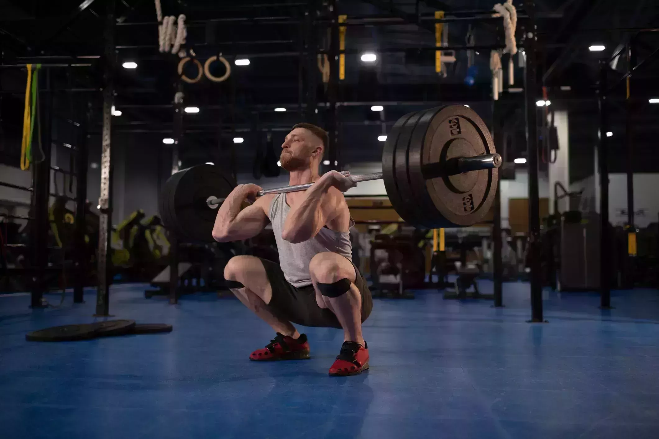 sportsman ready to push barbell from squat