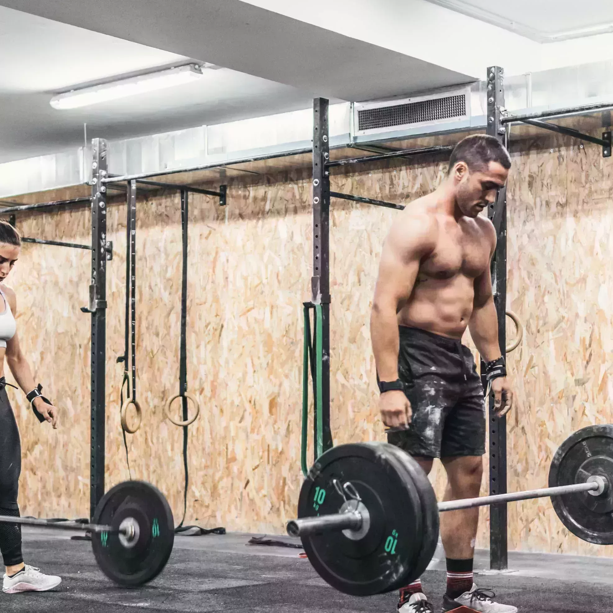 couple of man and woman doing weights in gym, gym