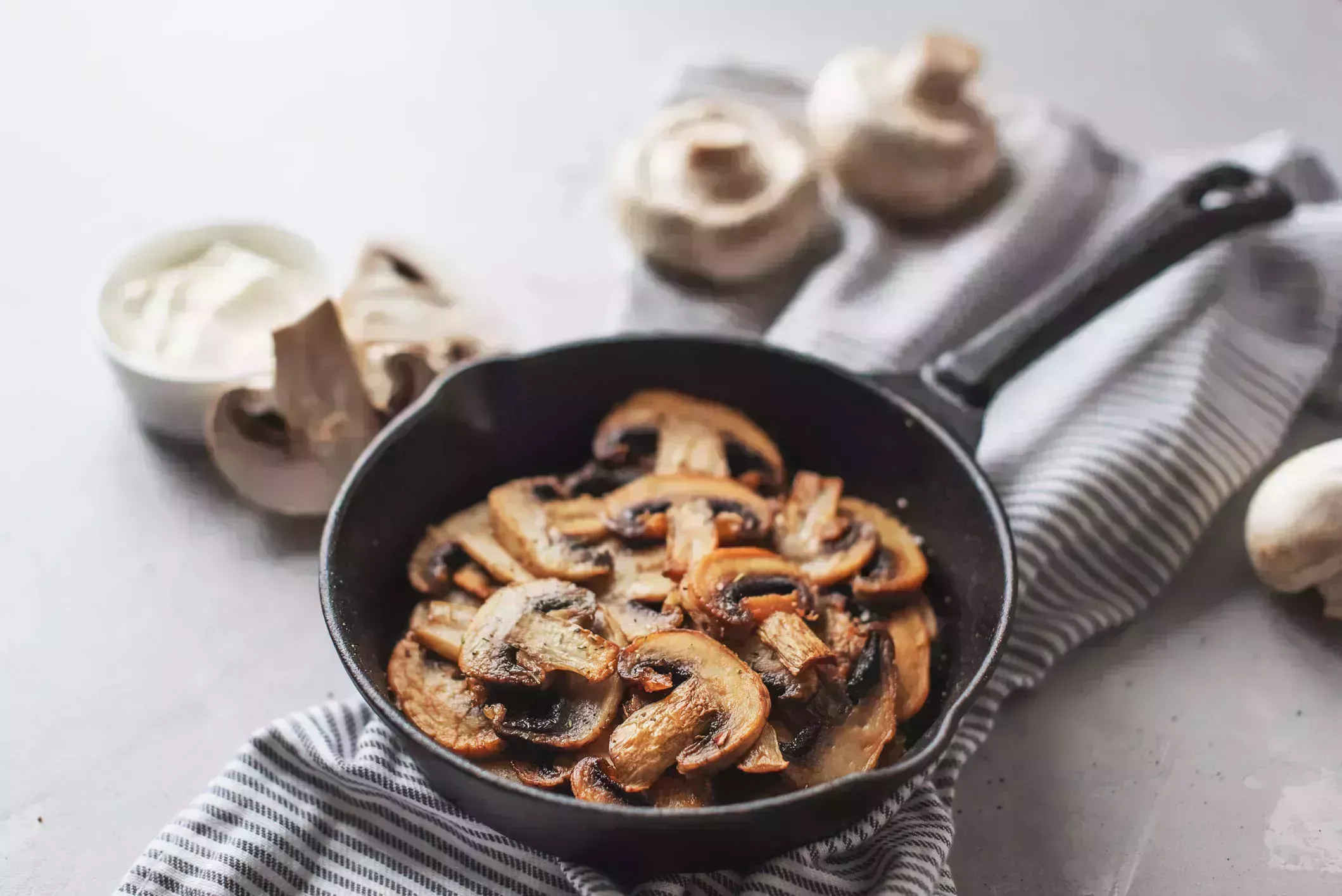 delicious fried mushrooms with flat bread and herbs on the wooden table