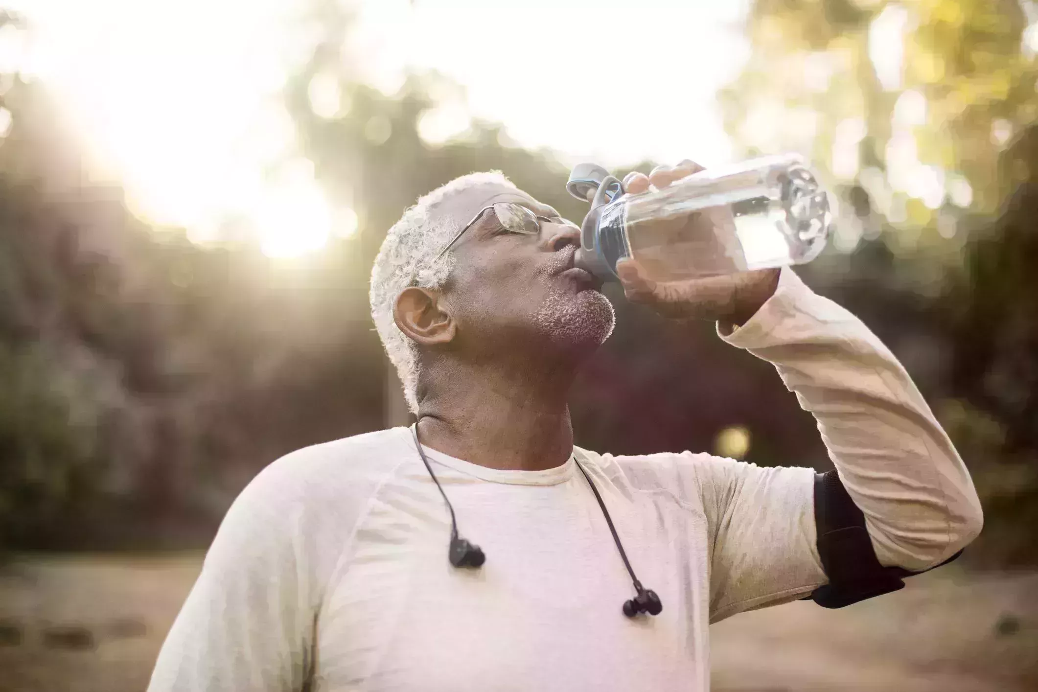 senior african american man drinking water
