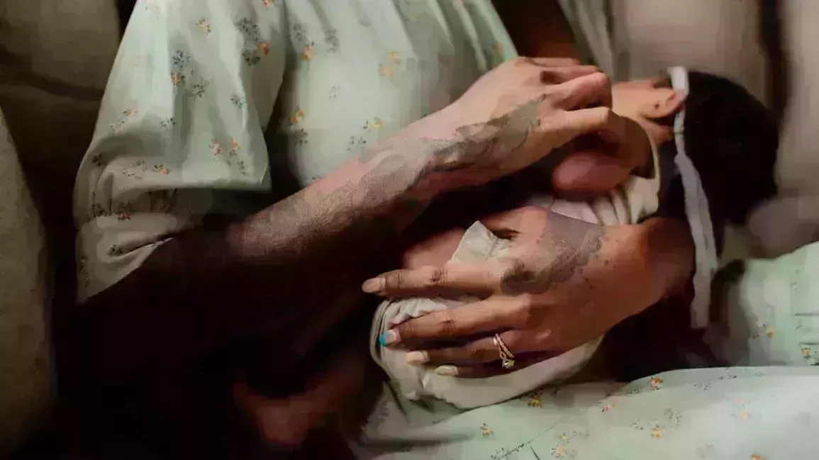 woman nursing her newborn