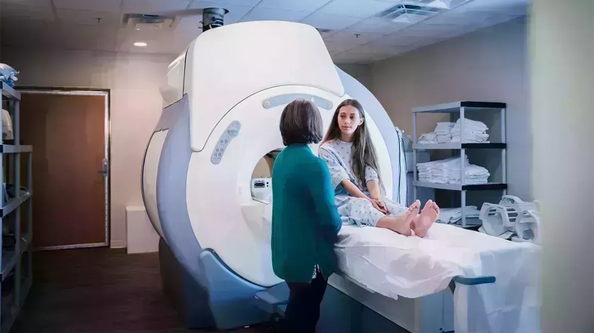 teenage girl getting an MRI to help with staging Ewing Sarcoma