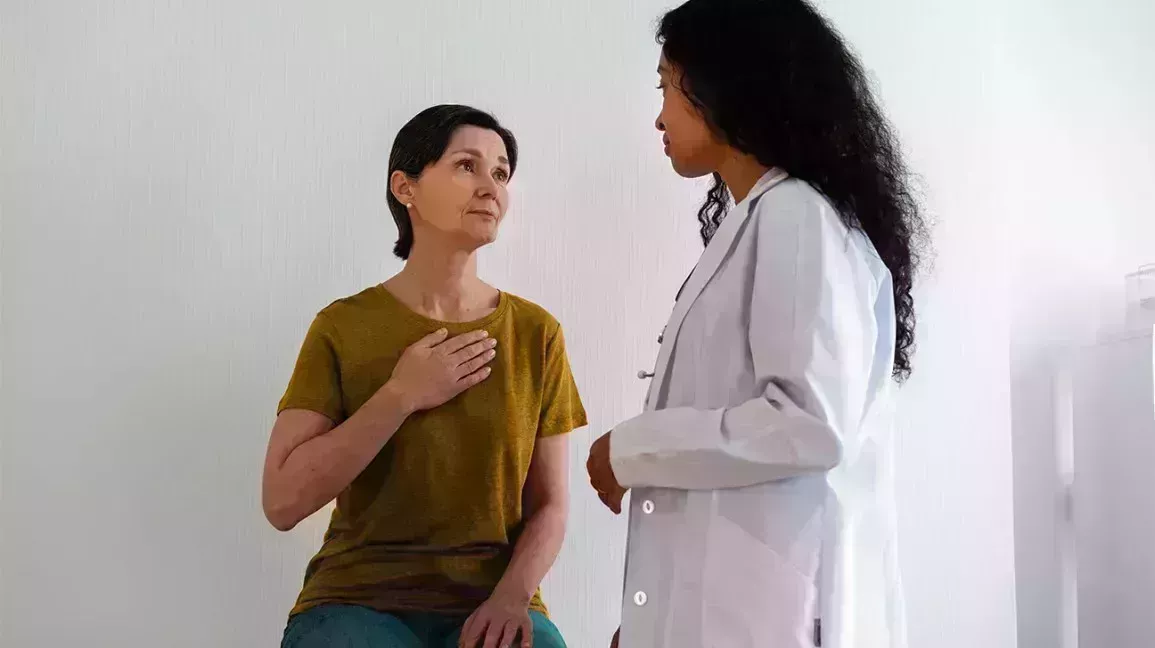 woman with hemochromatosis speaking with her doctor