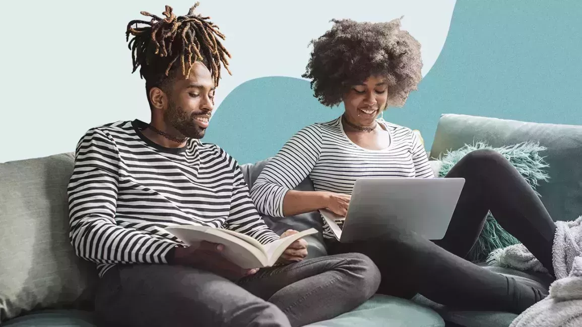 A couple sitting on a couch