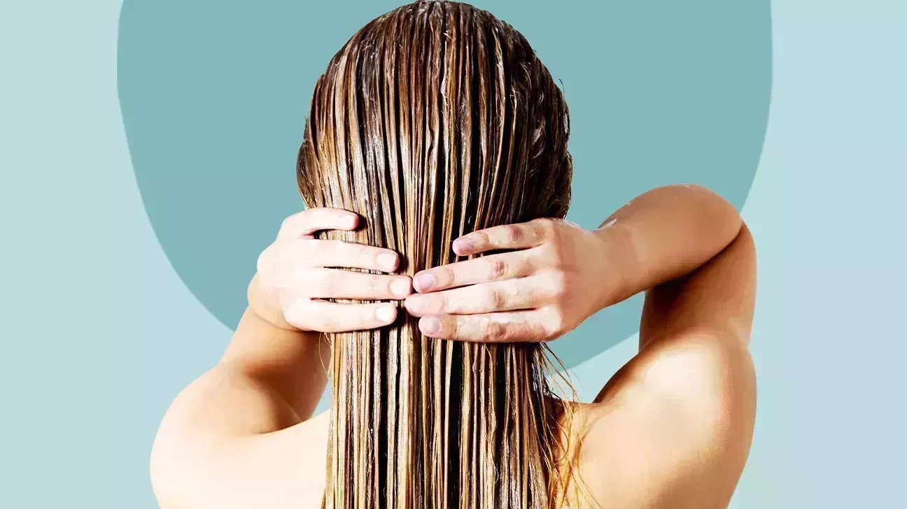 woman with long wet hair from the back