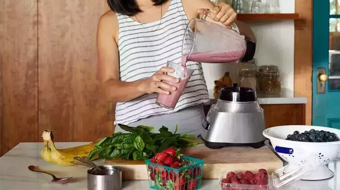 Woman making a smoothie