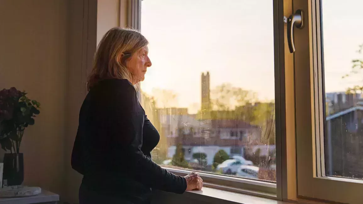 Woman looking out the window