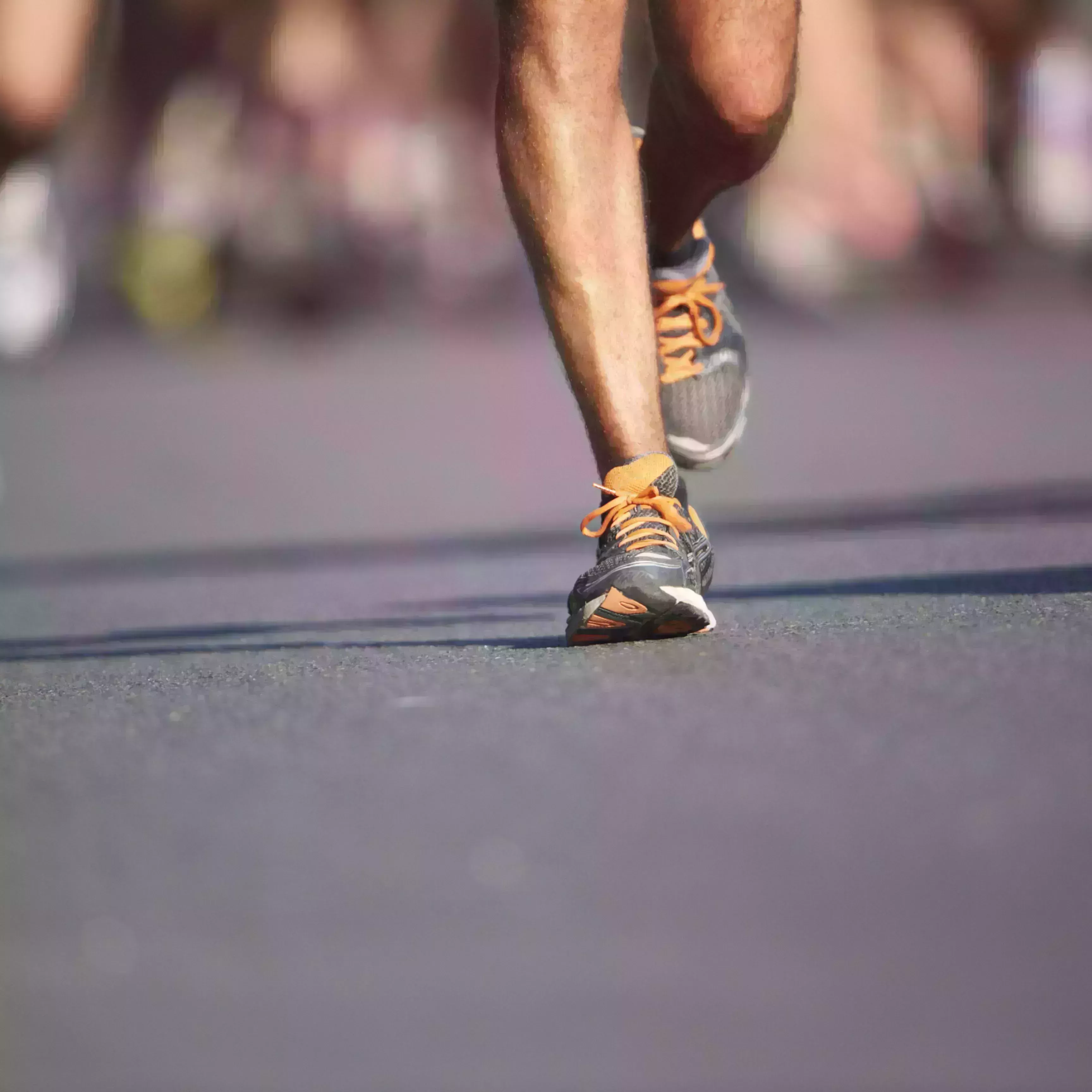 legs and feet of joggers, running a marathon