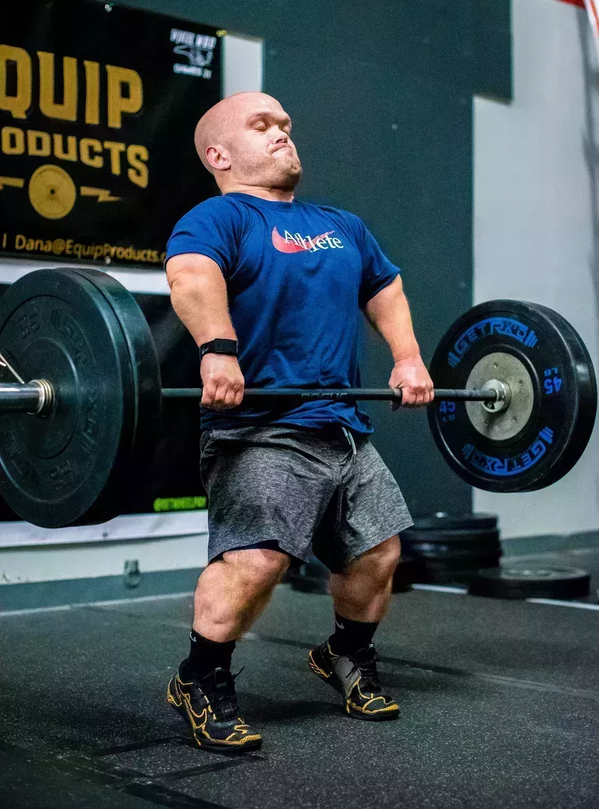 small person lifting weights