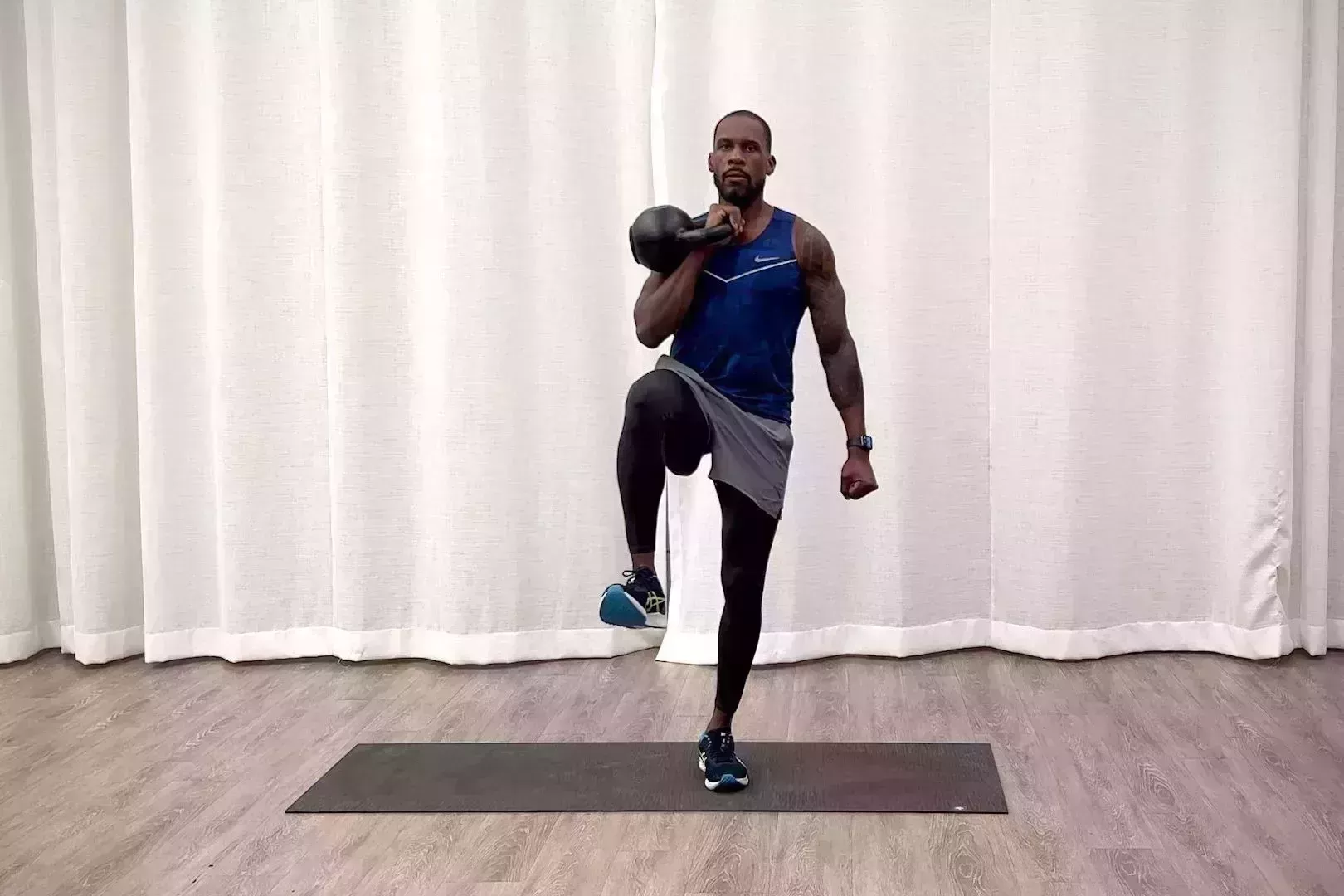 beginner kettlebell workout, jeffers practices front racked march exercise