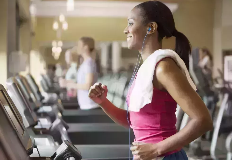 African American woman exercising on treadmill in gym african american woman exercising on treadmill in gym