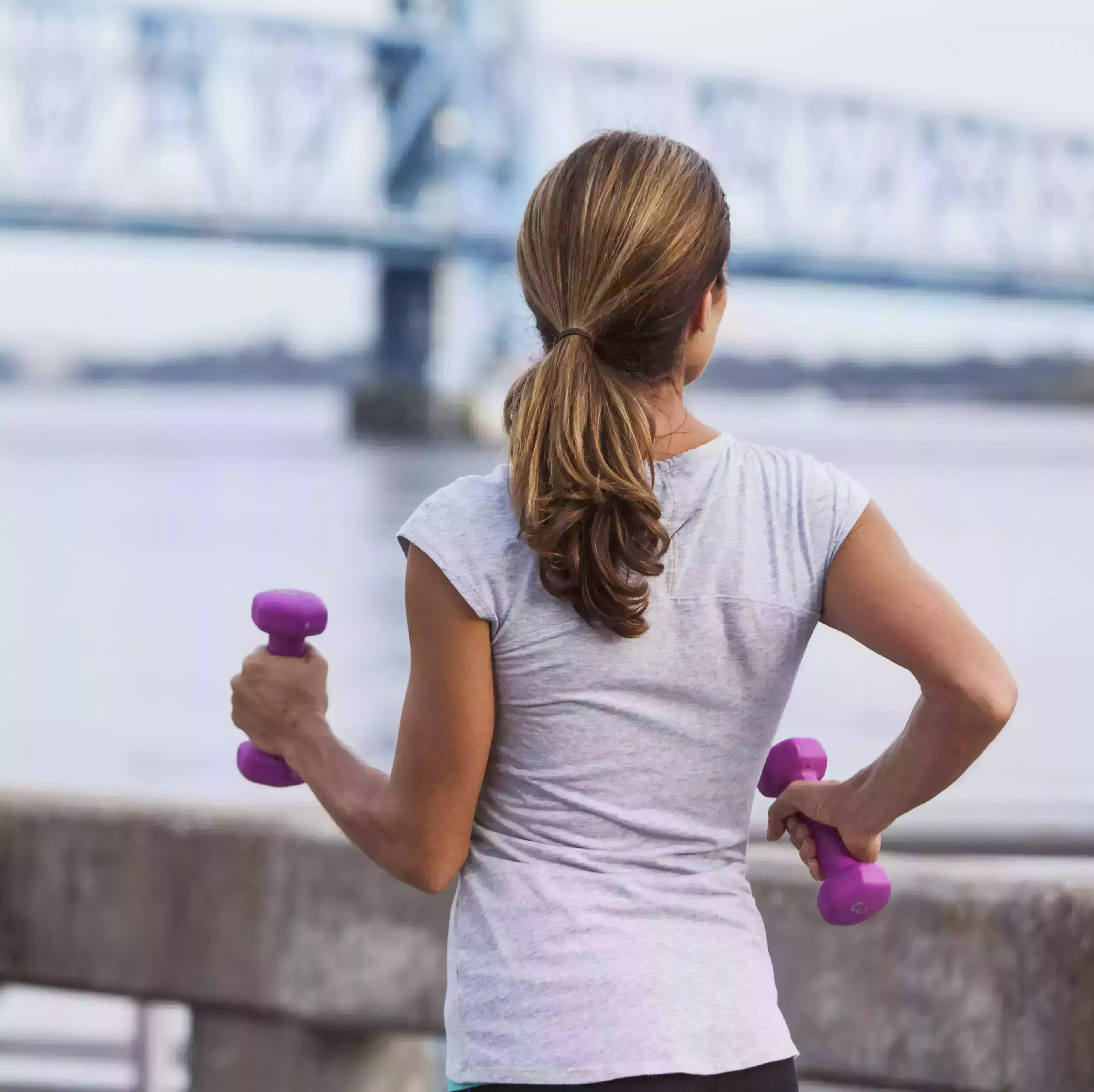 mature woman jogging or power walking on waterfront