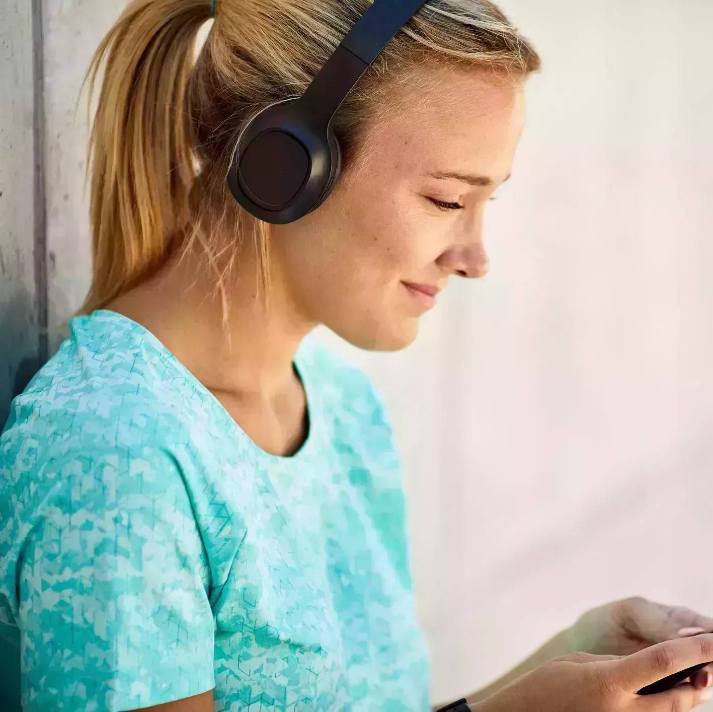 close up view of a young argentinian women using a mobile music app