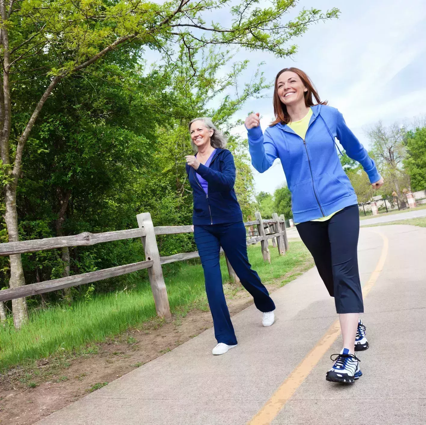 multi generational women walking together on a trail