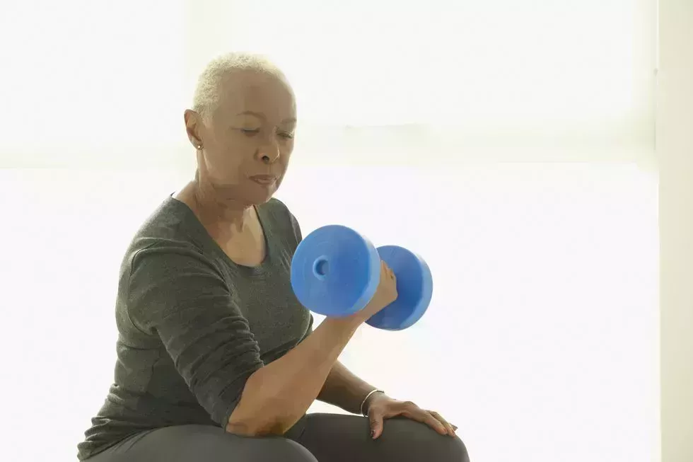 black woman lifting weights