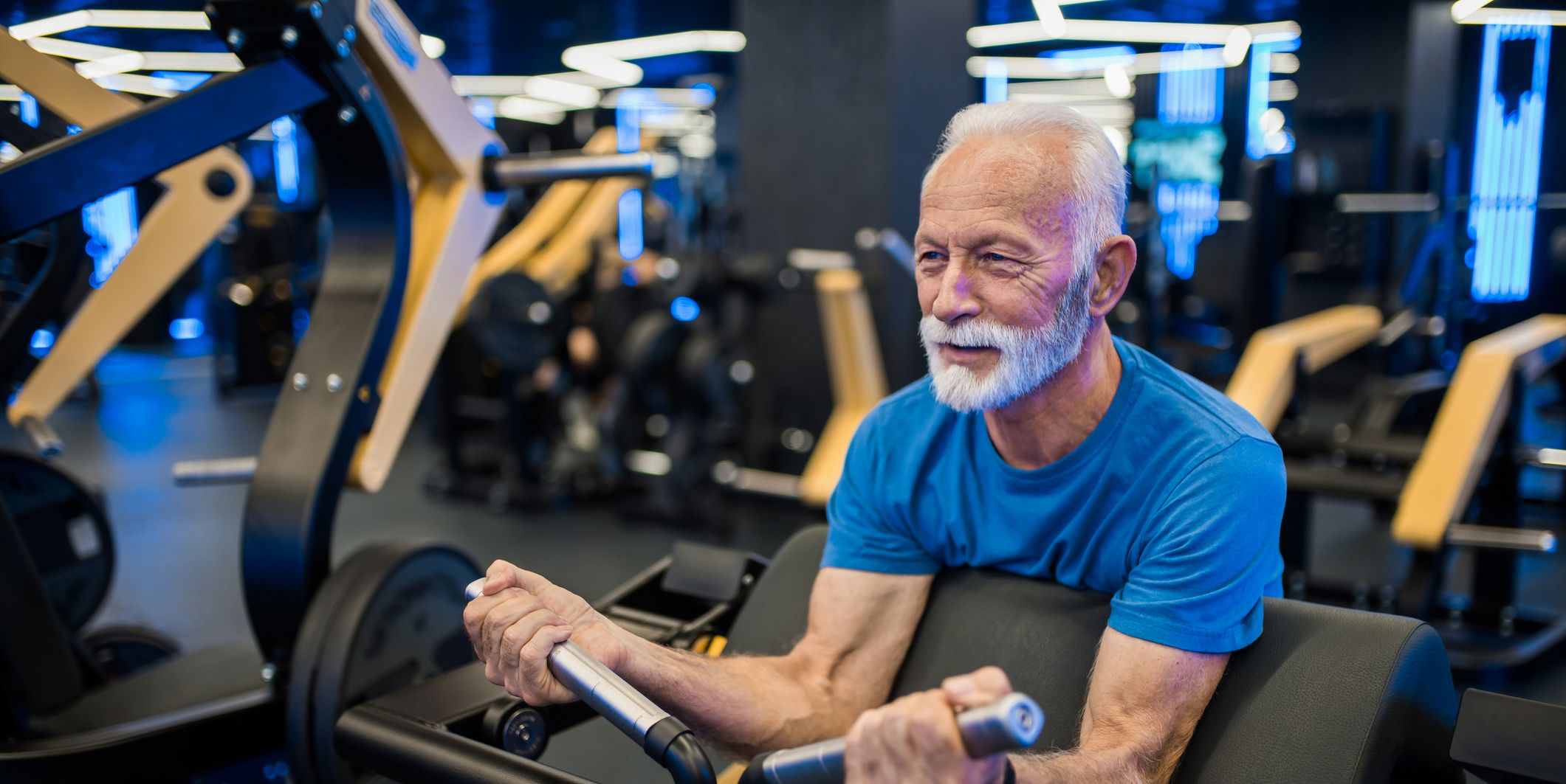 Senior man exercising in the gym.